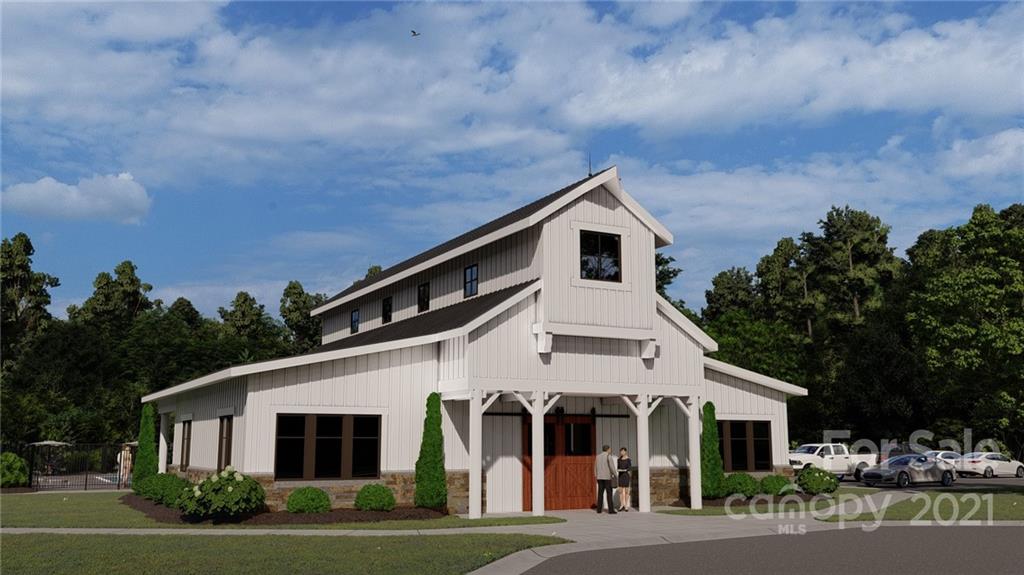 1619 Moore Farm Road, Unit 184 Indian Trail, NC 28079 - Photo 24 of 28 a front view of a house with a garden