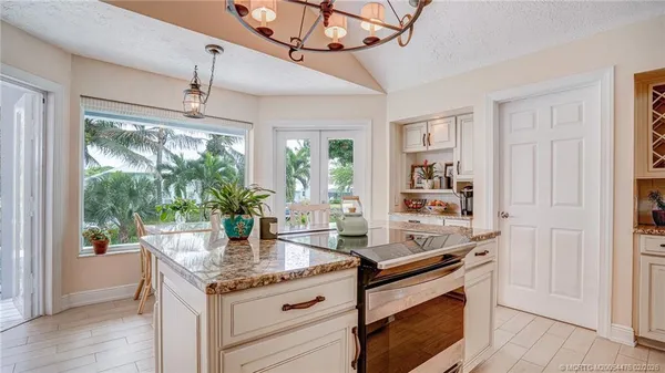 a kitchen with a sink and large window