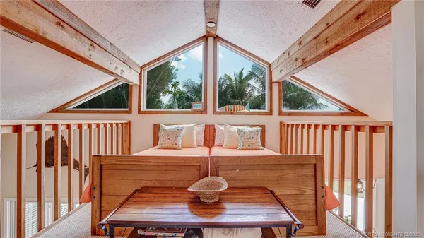 a living room with a large window and table