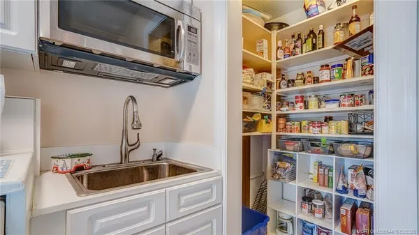 a room with a book shelf and a wooden floor