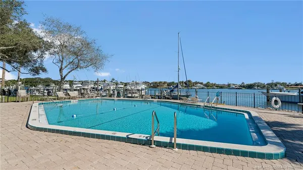 a view of a swimming pool with a chair