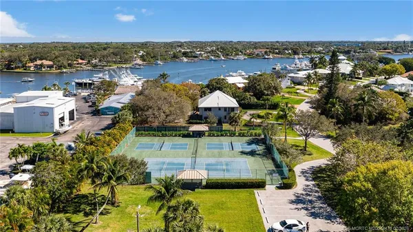 an aerial view of a house with a lake view