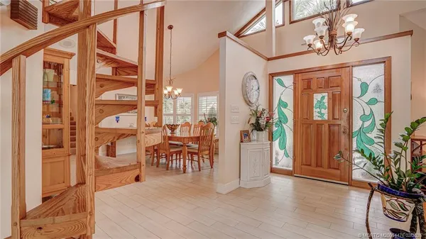a view of a entryway with furniture and wooden floor