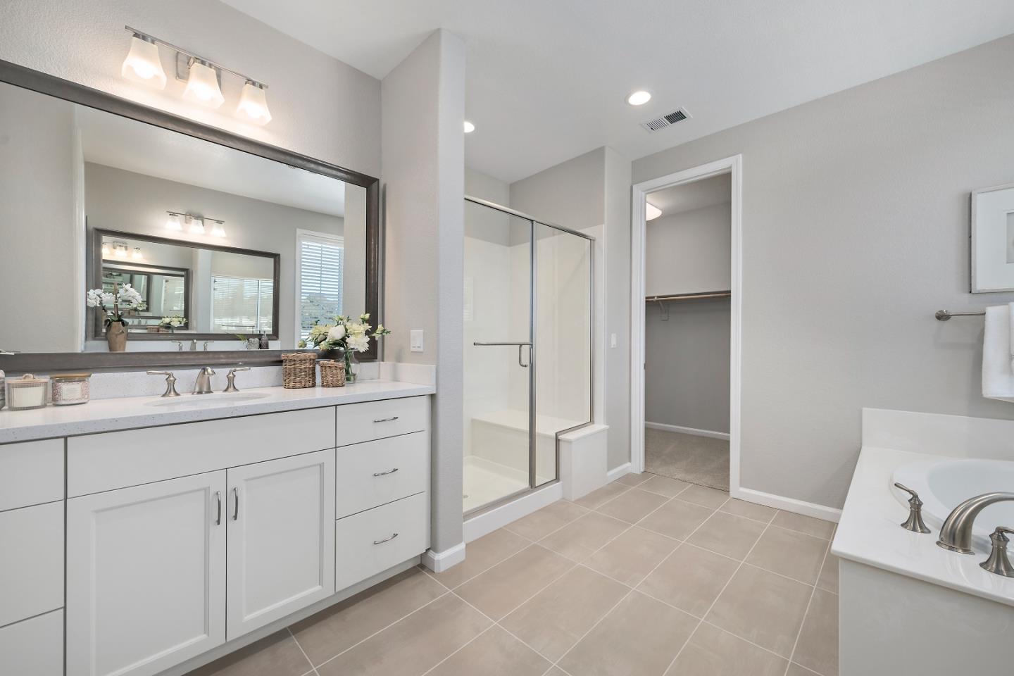 5010 Brook Valley Loop San Jose, CA 95136 - Photo 15 of 24 a spacious bathroom with a double vanity sink mirror and double