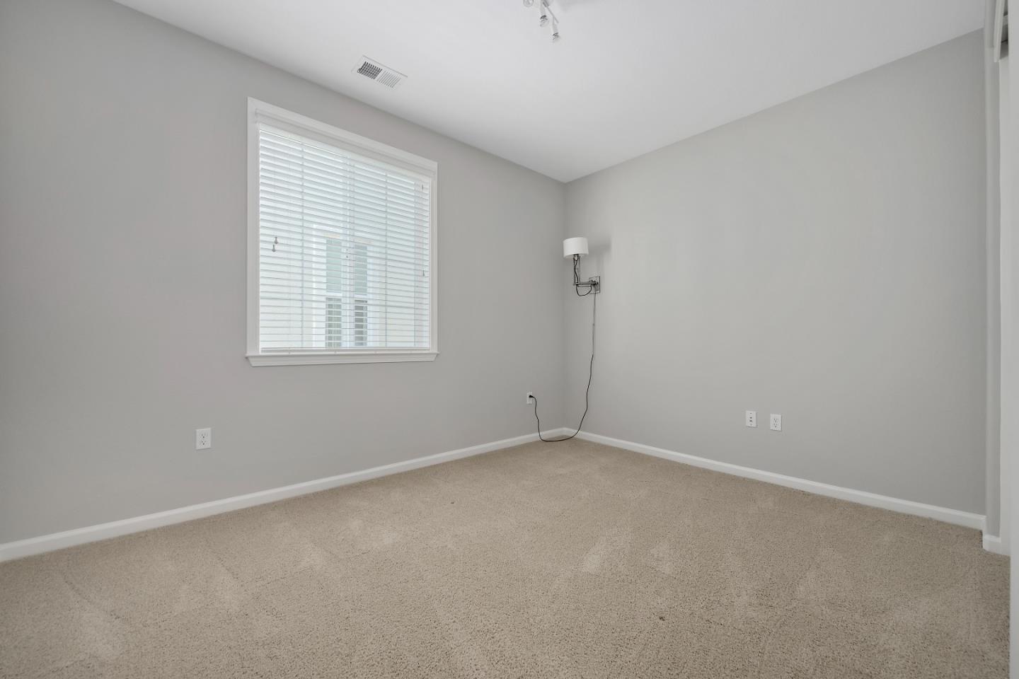 5010 Brook Valley Loop San Jose, CA 95136 - Photo 19 of 24 an empty room with windows