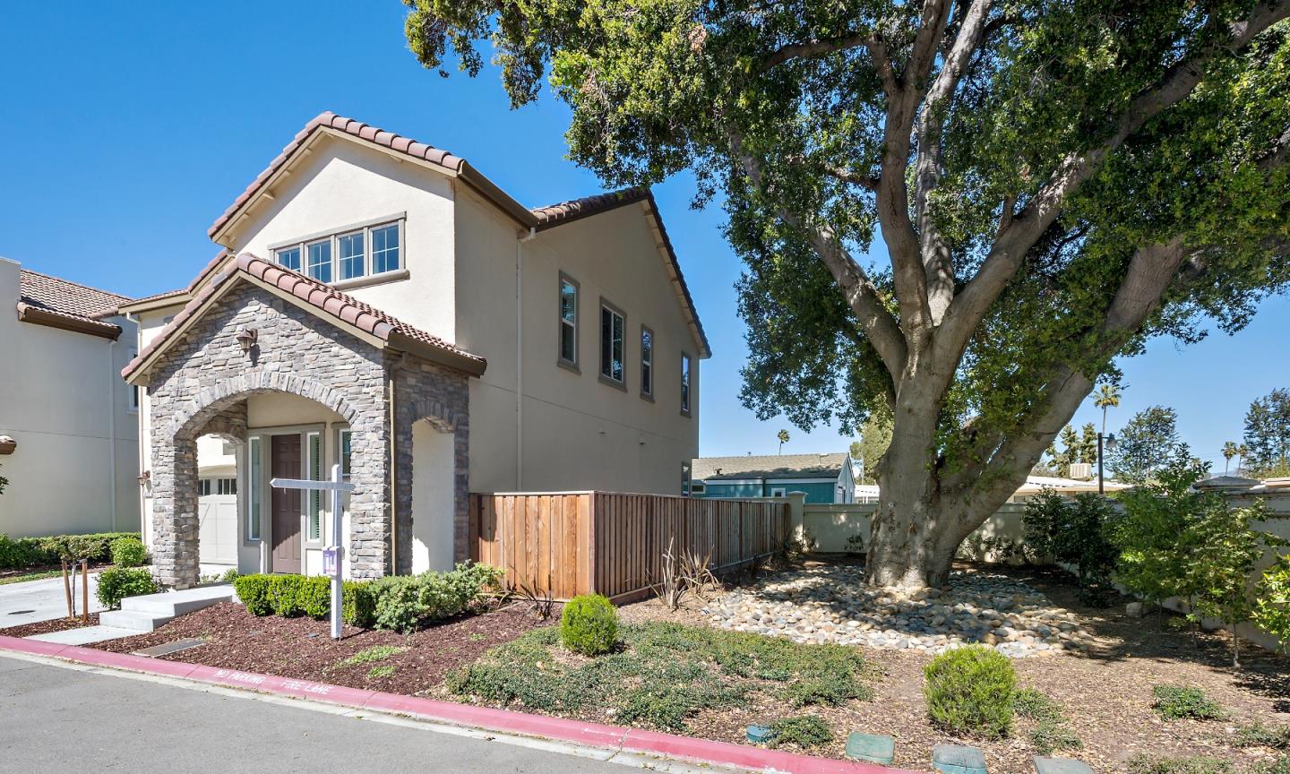5010 Brook Valley Loop San Jose, CA 95136 - Photo 2 of 24 a front view of a house with garden