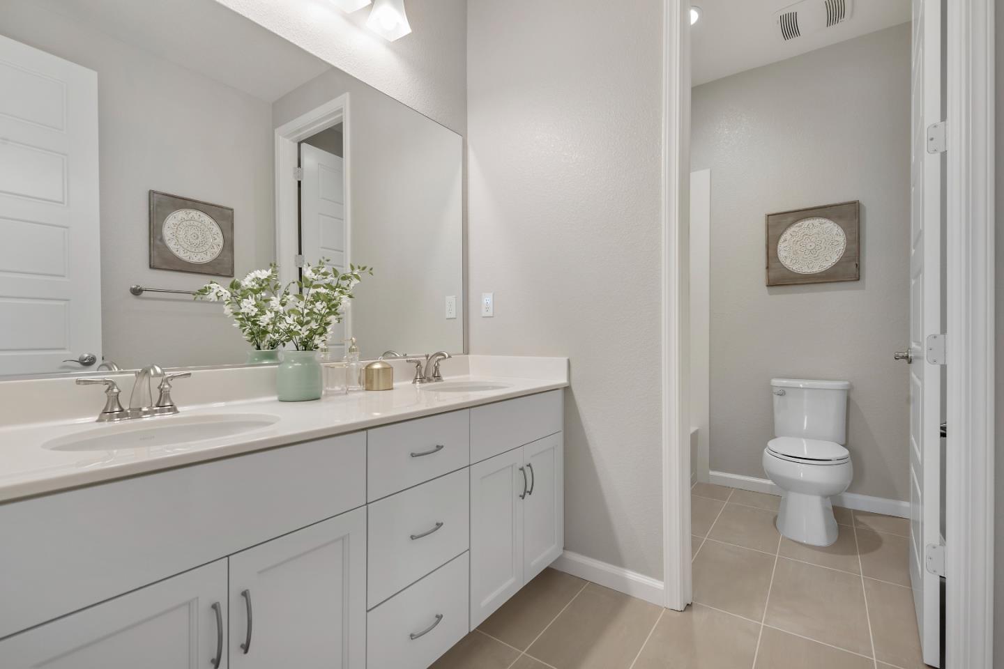 5010 Brook Valley Loop San Jose, CA 95136 - Photo 21 of 24 a bathroom with a toilet sink and mirror