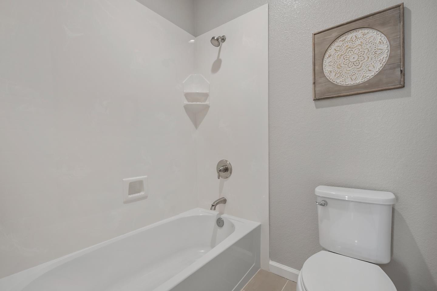 5010 Brook Valley Loop San Jose, CA 95136 - Photo 22 of 24 a bathroom with a toilet and a bathtub
