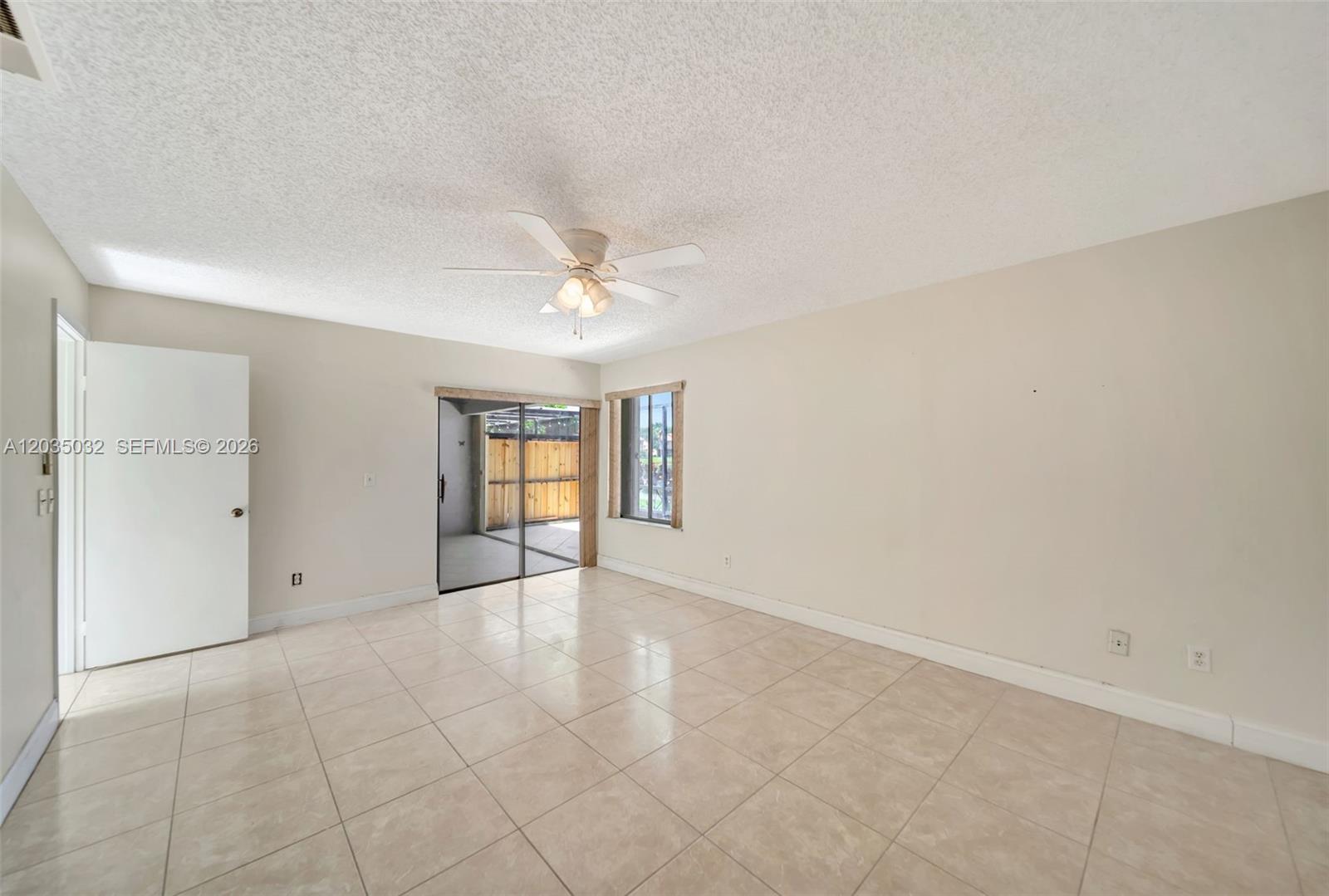 5223 Gate Lake Road, Unit 5223 Tamarac, FL 33319 - Photo 23 of 37 a view of an empty room with a window