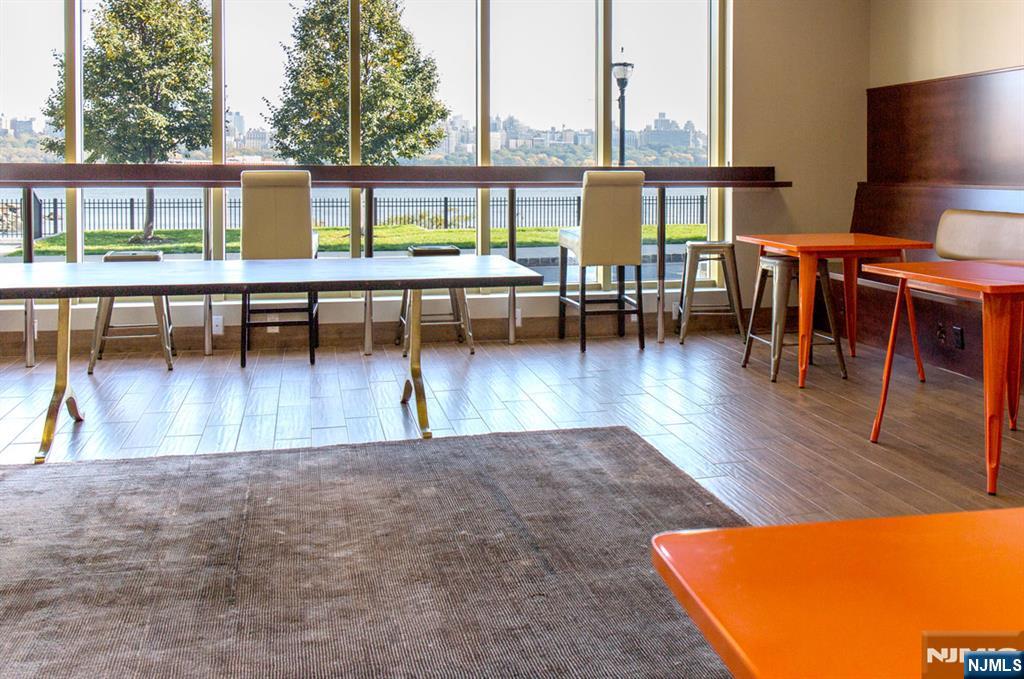 4 Main Street, Unit F Edgewater, NJ 07020 - Photo 15 of 20 a view of a swimming pool with outdoor seating