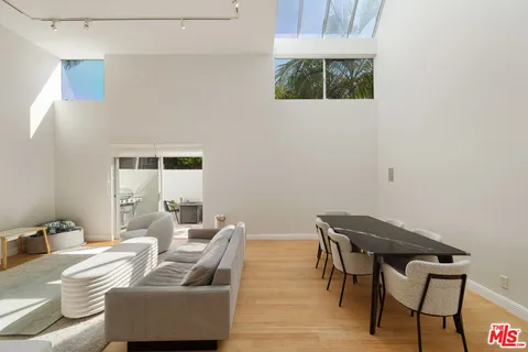 a view of a livingroom with furniture and a table