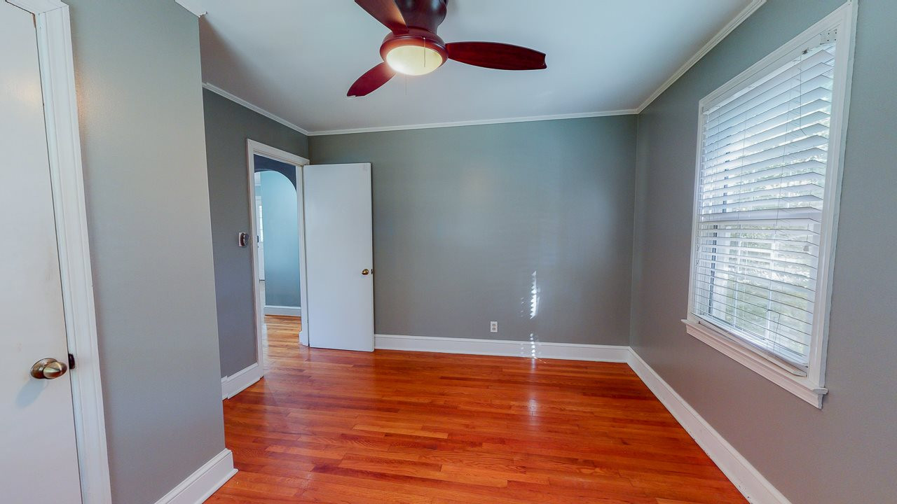 245 Howard Clayton Road Timberlake, NC 27583 - Photo 16 of 30 an empty room with wooden floor and windows