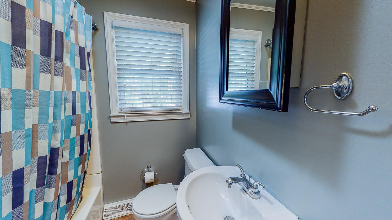 245 Howard Clayton Road Timberlake, NC 27583 - Photo 17 of 30 a bathroom with a sink a toilet and a shower