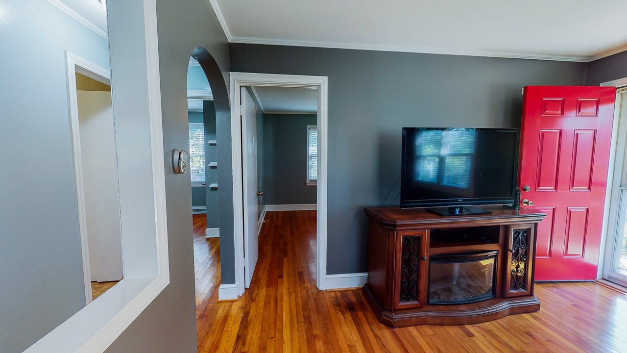 245 Howard Clayton Road Timberlake, NC 27583 - Photo 20 of 30 a living room with a flat screen tv and a fireplace