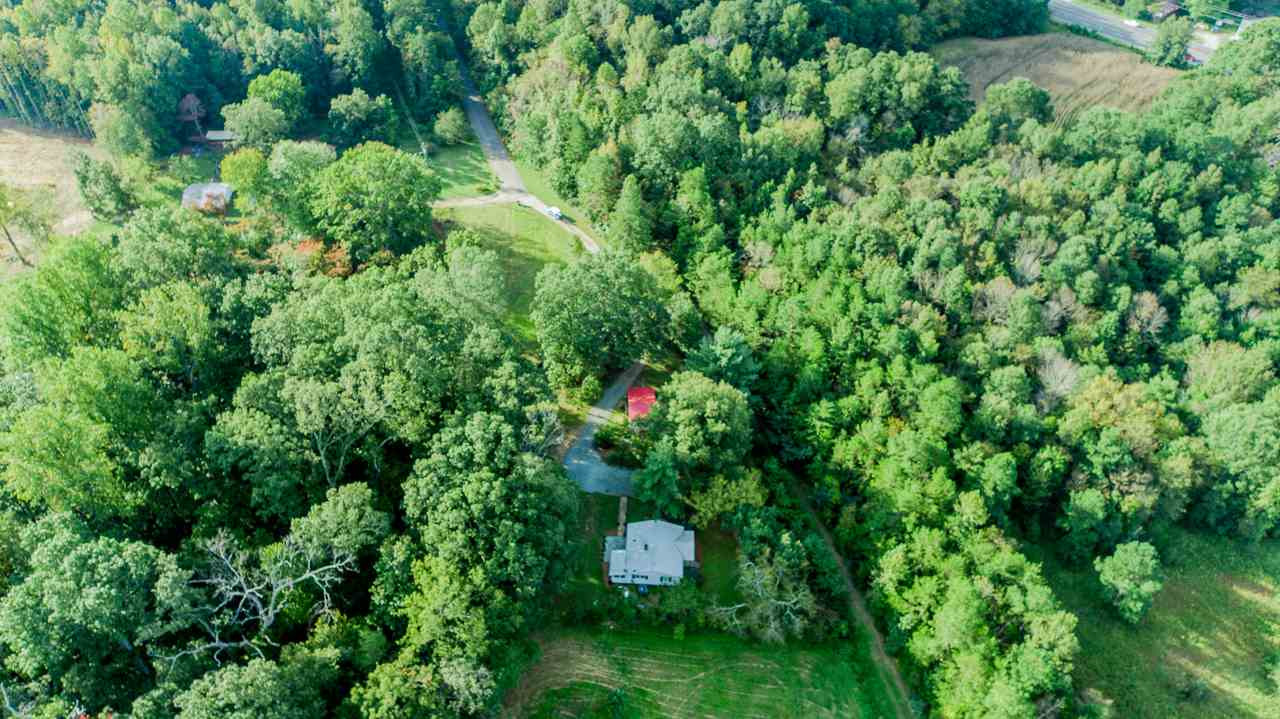 245 Howard Clayton Road Timberlake, NC 27583 - Photo 29 of 30 a backyard of a house with lots of green space