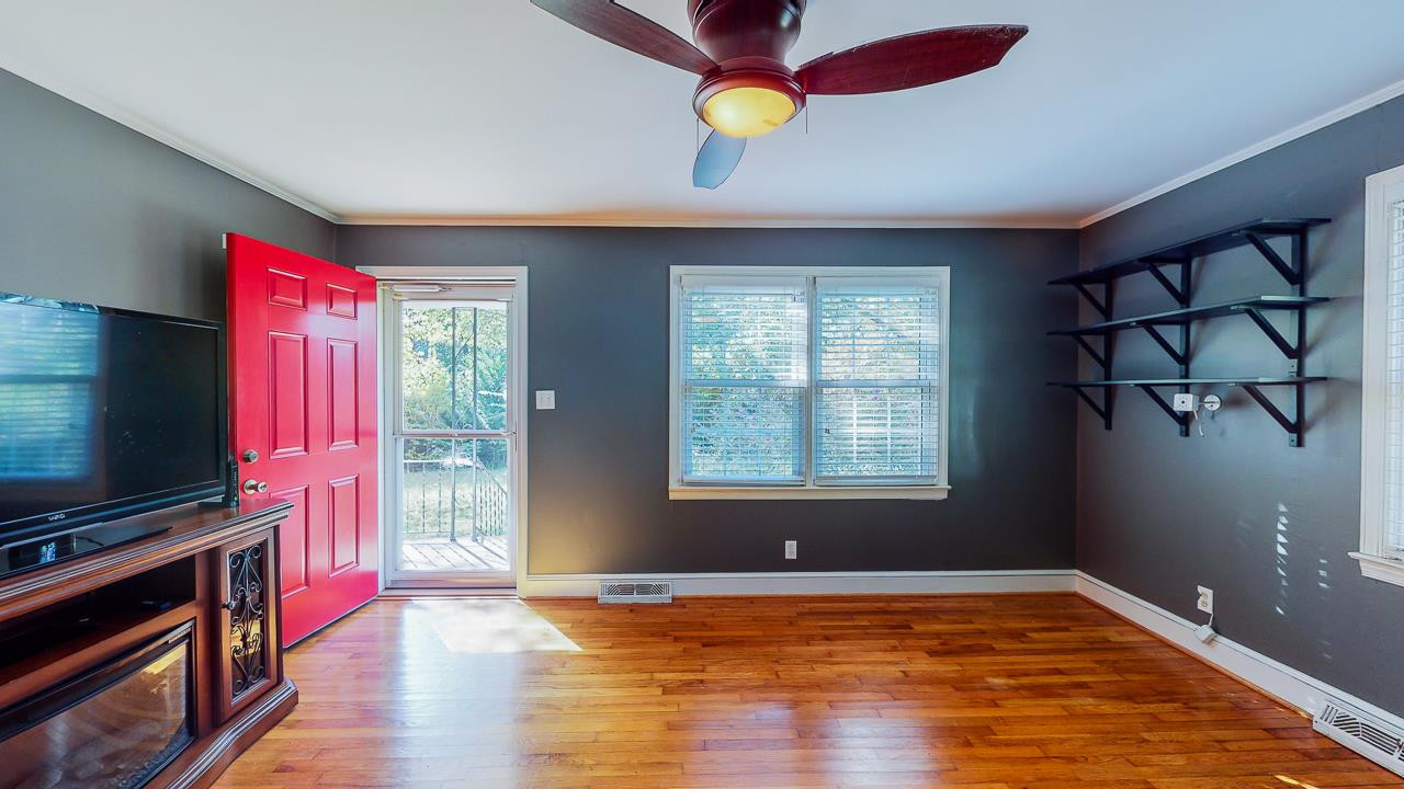 245 Howard Clayton Road Timberlake, NC 27583 - Photo 7 of 30 a view of a room with wooden floor and windows