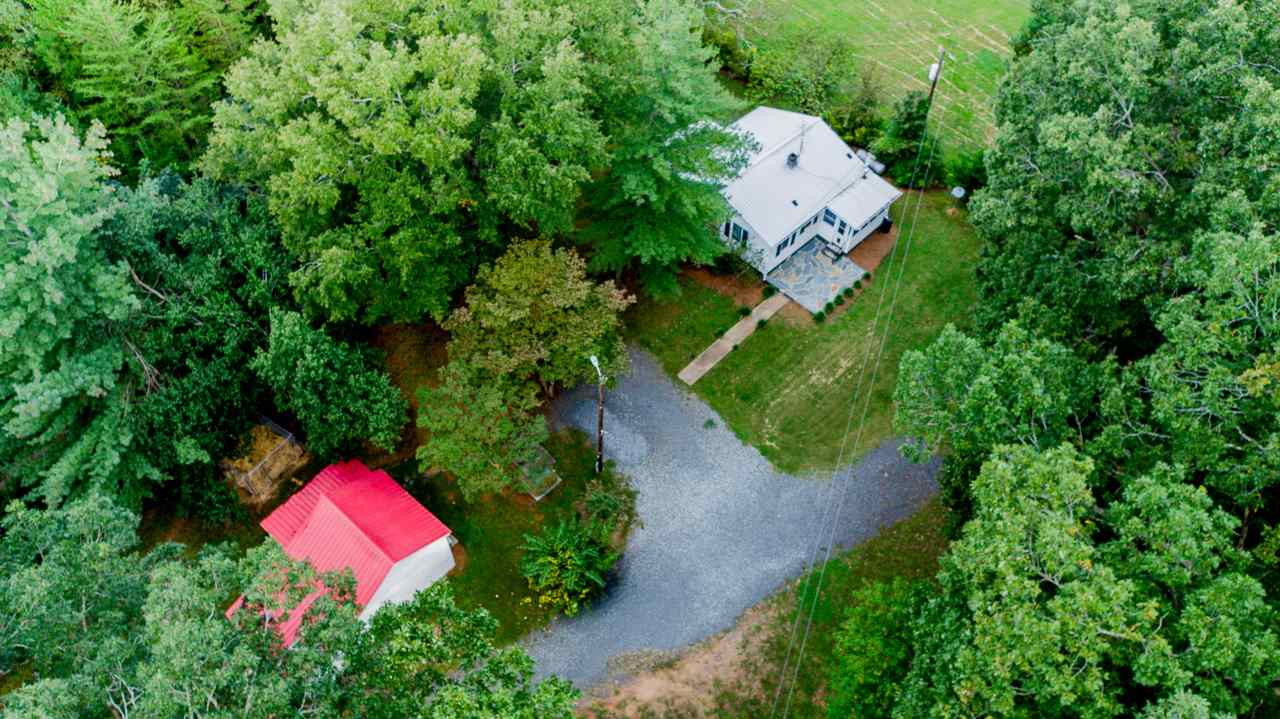 245 Howard Clayton Road Timberlake, NC 27583 - Photo 8 of 30 an aerial view of a house with a yard and a large tree
