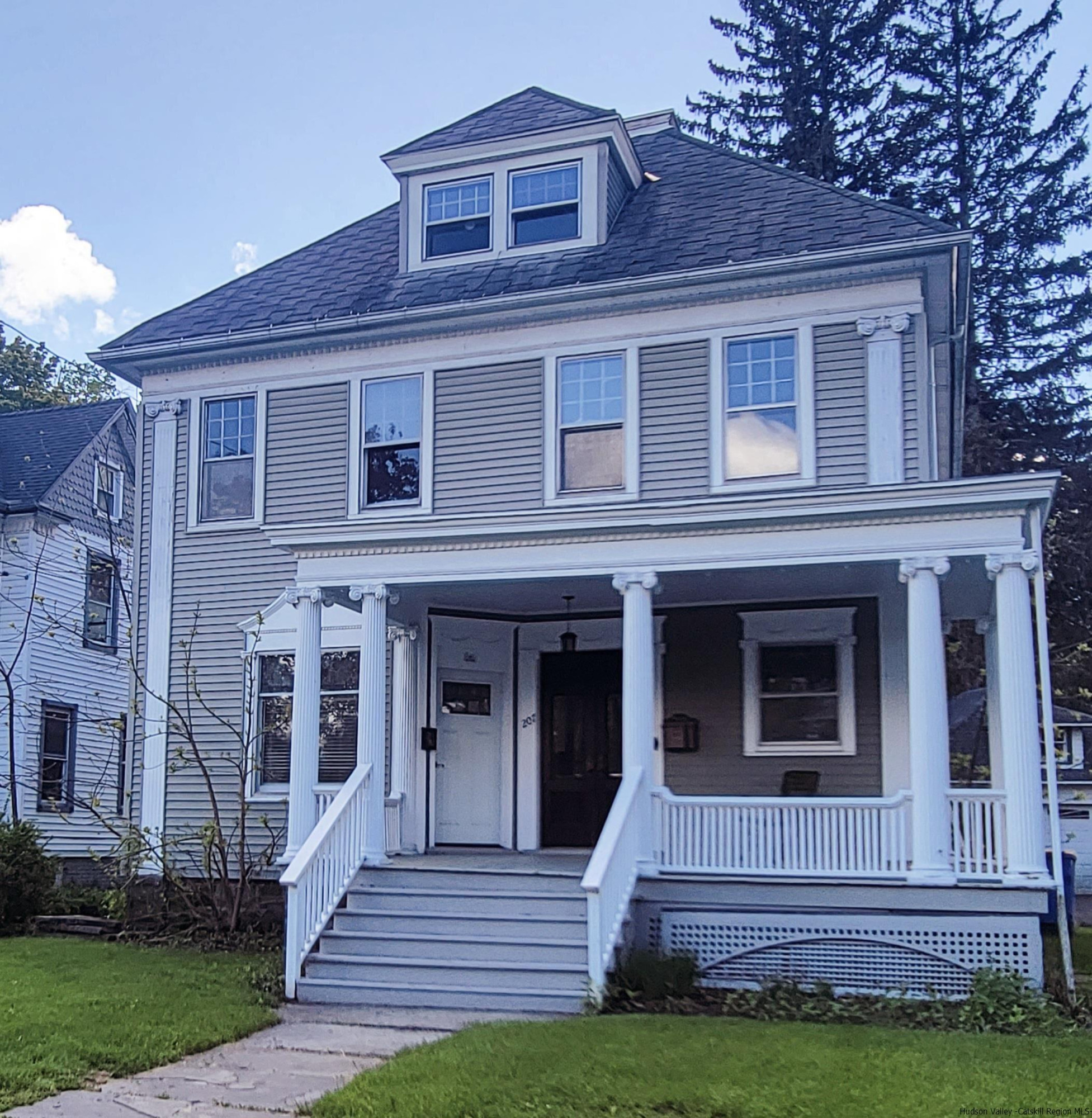 a view of house with yard
