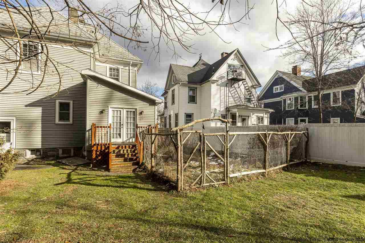 Undisclosed Address Kingston, NY 12401 - Photo 15 of 34 a view of a white house with a large tree and couches chairs