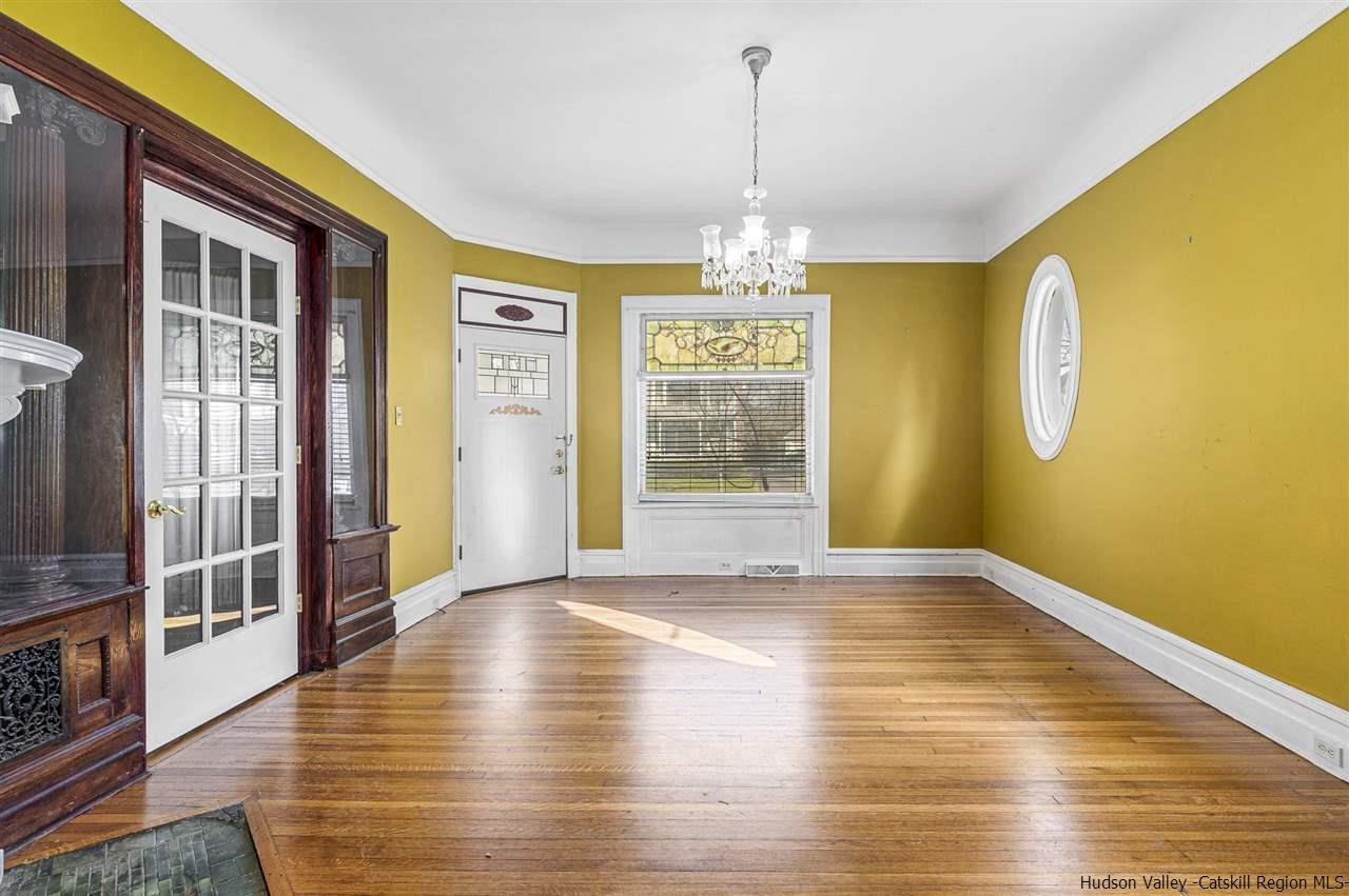 Undisclosed Address Kingston, NY 12401 - Photo 24 of 34 a view of a room with wooden floor chandelier and windows