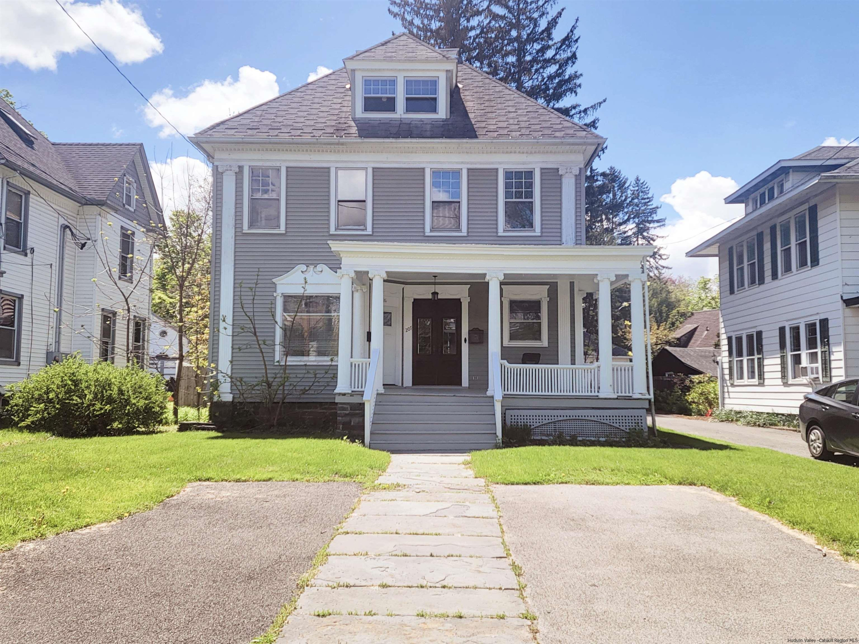 Undisclosed Address Kingston, NY 12401 - Photo 34 of 34 a front view of a brick house with a yard