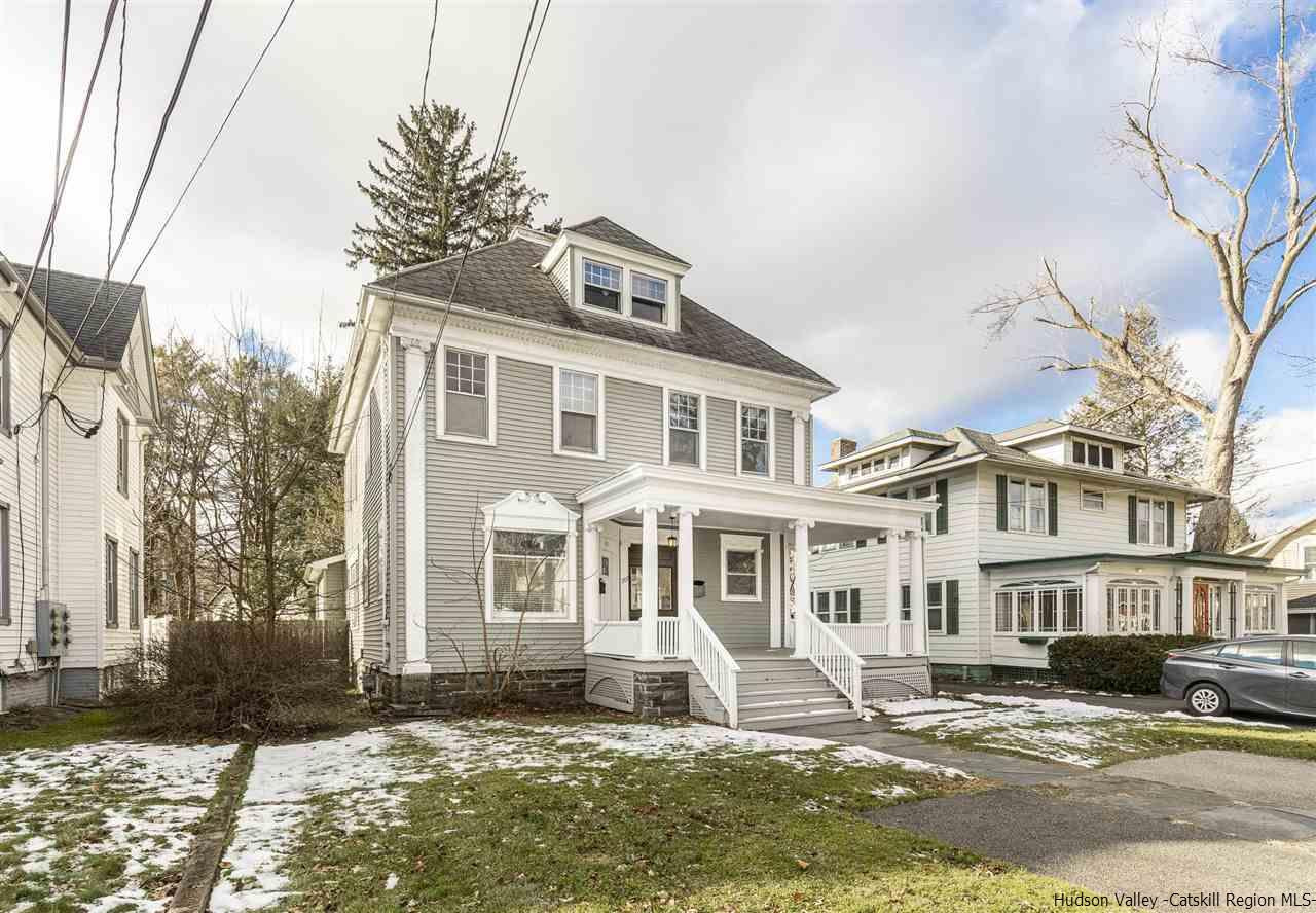 Undisclosed Address Kingston, NY 12401 - Photo 5 of 34 a front view of a building with a yard