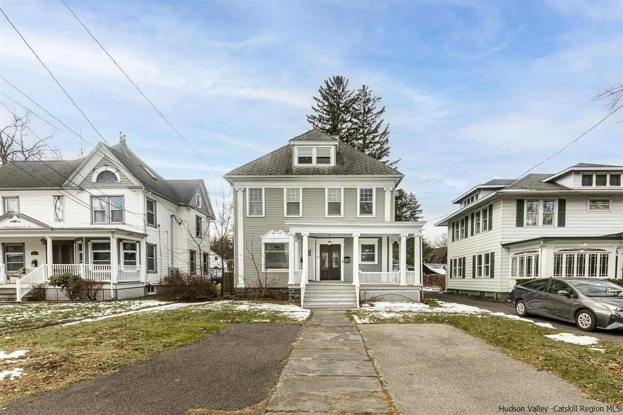 Undisclosed Address Kingston, NY 12401 - Photo 7 of 34 a front view of a residential apartment building with a yard