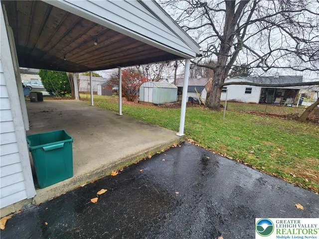 a view of a house with a sink and a yard