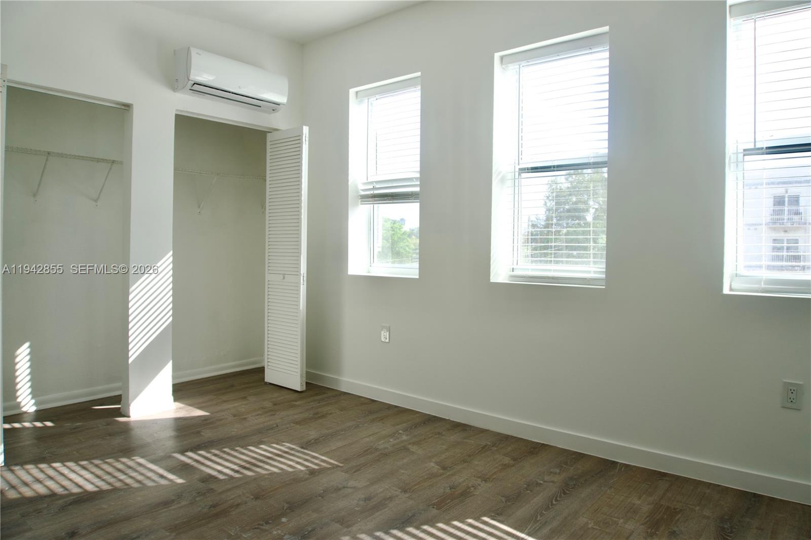 501 Southwest 6th Court, Unit 325 Miami, FL 33130 - Photo 2 of 25 a view of an empty room with a window