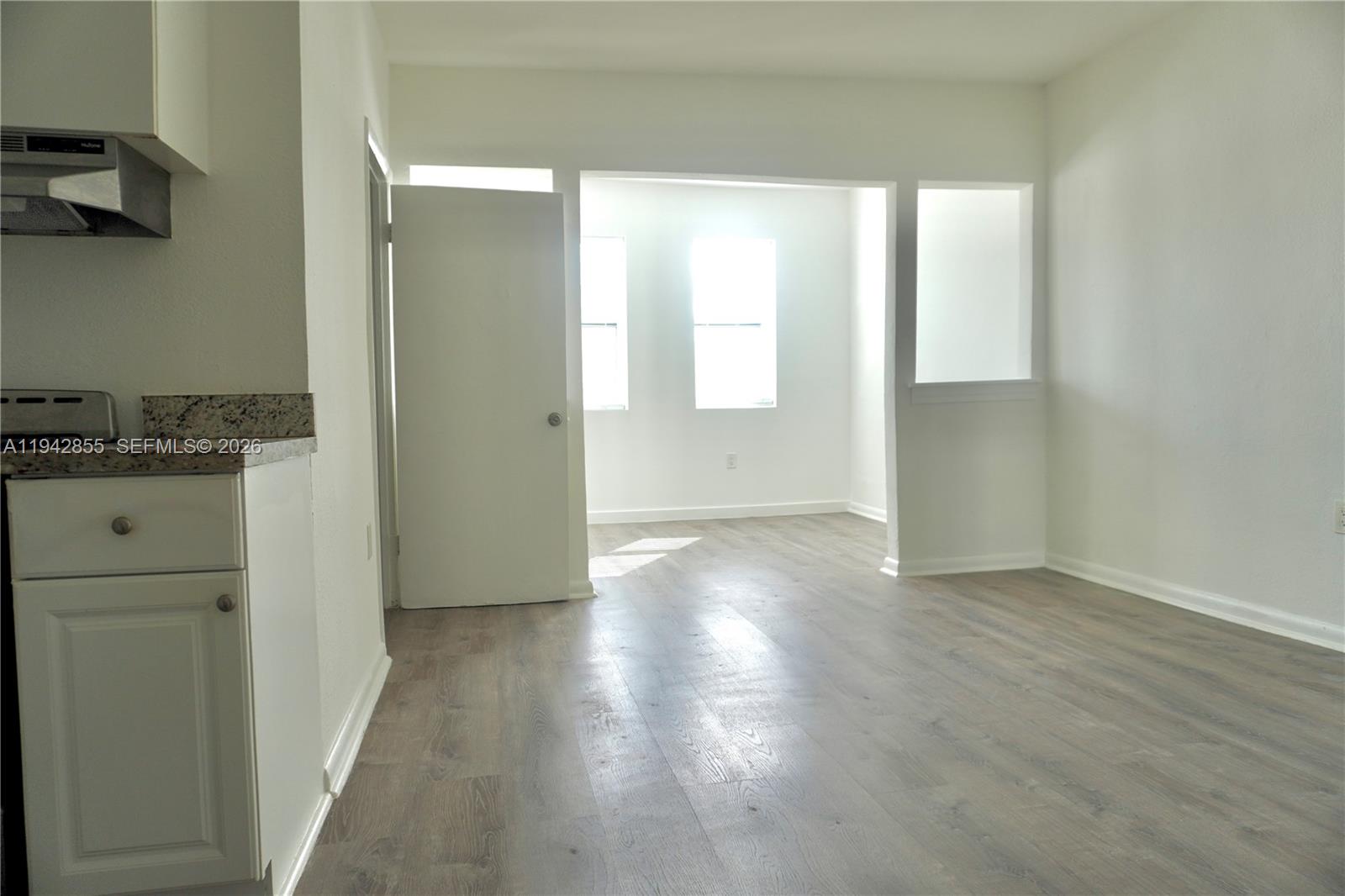 501 Southwest 6th Court, Unit 325 Miami, FL 33130 - Photo 10 of 25 wooden floor in an empty room