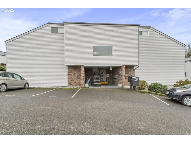 a view of a car parked in front of a building