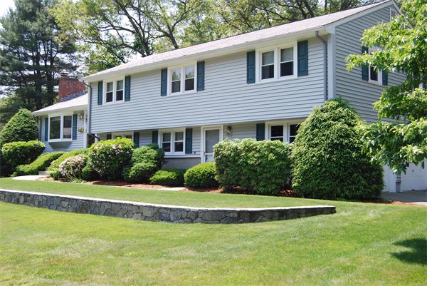 76 Joyce Road Framingham, MA 01701 - Photo 1 of 22 a view of a house with a yard patio and a large tree