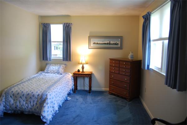 76 Joyce Road Framingham, MA 01701 - Photo 15 of 22 a bedroom with a bed and a dresser in it