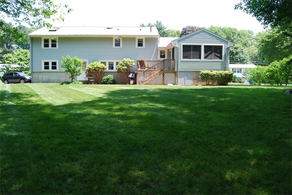 76 Joyce Road Framingham, MA 01701 - Photo 2 of 22 a front view of house with yard and green space