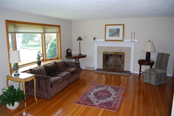 76 Joyce Road Framingham, MA 01701 - Photo 3 of 22 a living room with furniture and a fireplace