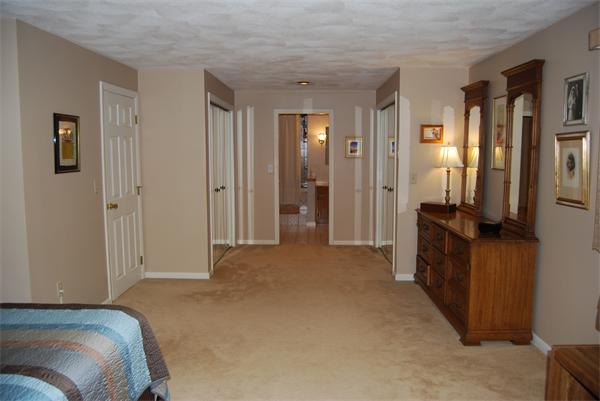 76 Joyce Road Framingham, MA 01701 - Photo 6 of 22 a living room with a bed and a walk in closet