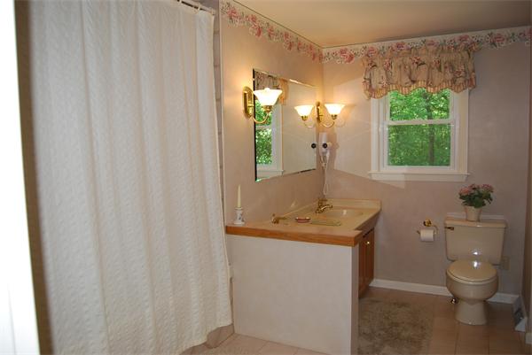 76 Joyce Road Framingham, MA 01701 - Photo 7 of 22 a bathroom with a toilet sink and mirror