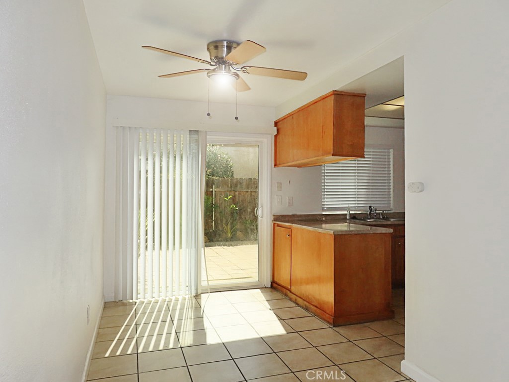 1373 Wheaton Way Riverside, CA 92507 - Photo 13 of 34 a kitchen with stainless steel appliances granite countertop a stove a sink and a refrigerator