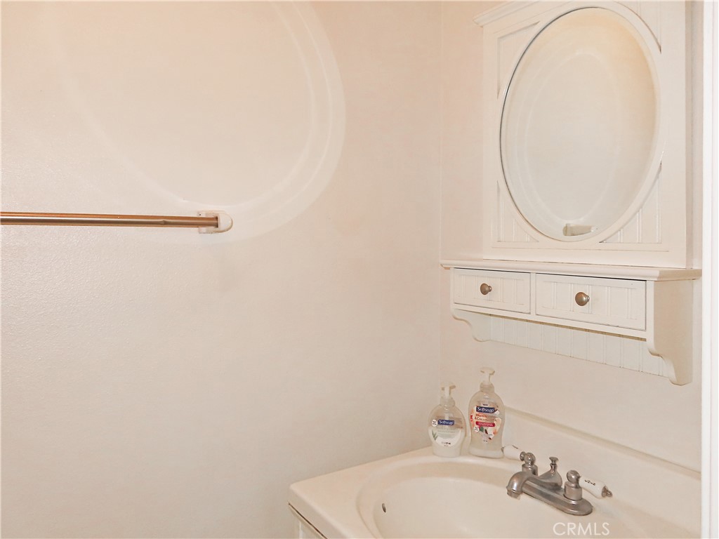 1373 Wheaton Way Riverside, CA 92507 - Photo 18 of 34 a bathroom with a sink and a mirror
