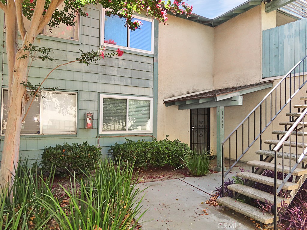 1373 Wheaton Way Riverside, CA 92507 - Photo 2 of 34 a front view of a house with a yard