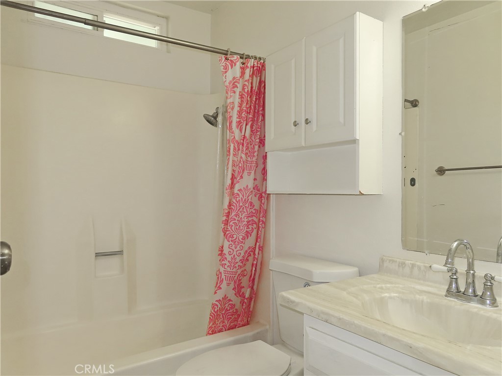 1373 Wheaton Way Riverside, CA 92507 - Photo 23 of 34 a bathroom with a sink and a shower