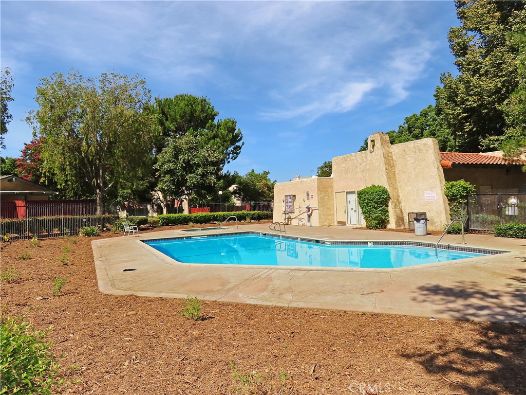 1373 Wheaton Way Riverside, CA 92507 - Photo 30 of 34 a view of a swimming pool and a yard