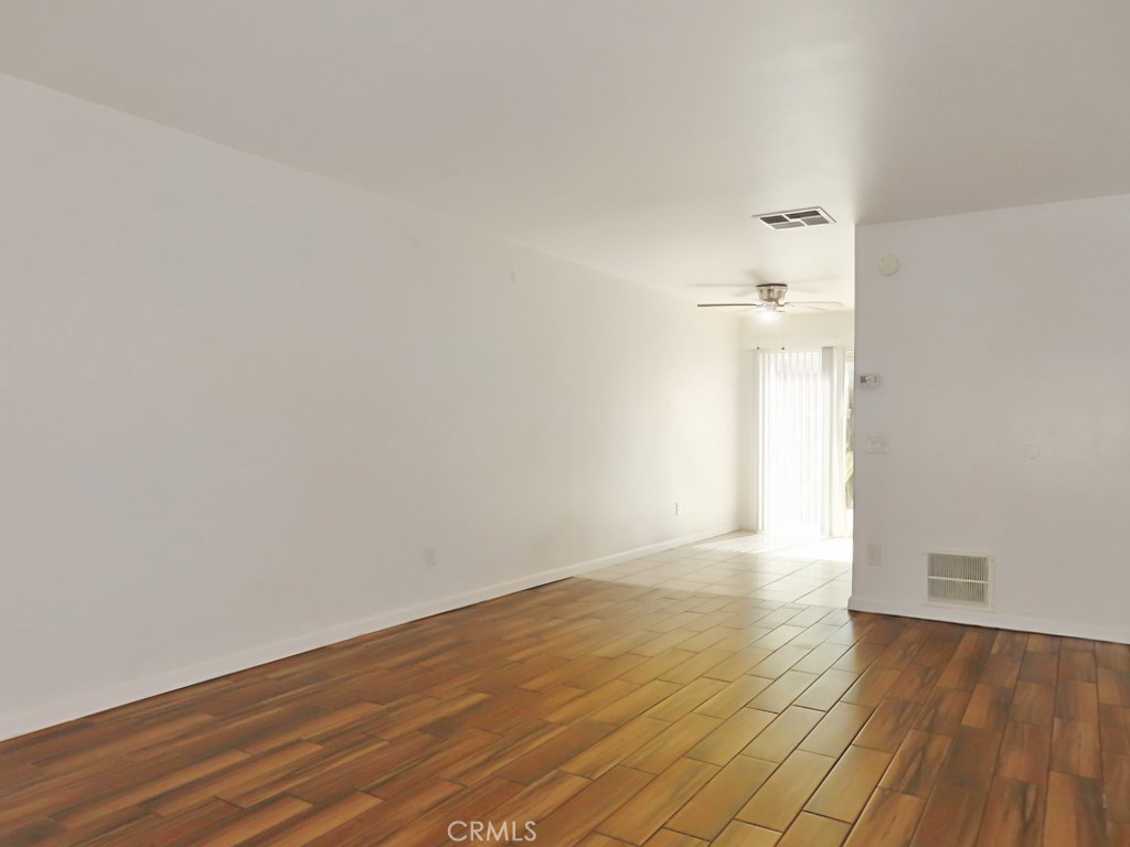 1373 Wheaton Way Riverside, CA 92507 - Photo 7 of 34 wooden floor in a empty room