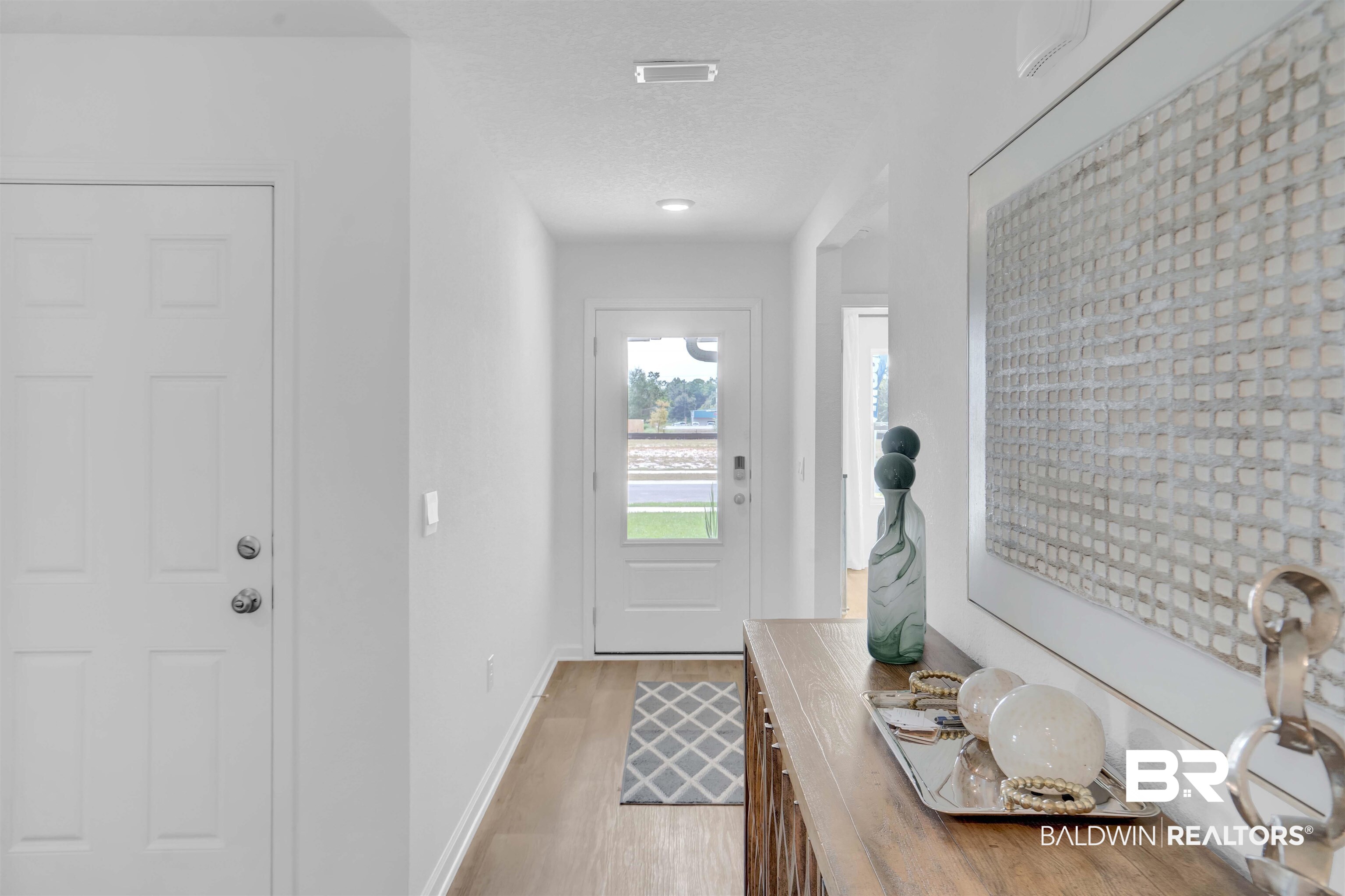 14717 Dayton Circle Foley, AL 36535 - Photo 3 of 39 Entryway featuring a textured ceiling and light hardwood / wood-style flooring