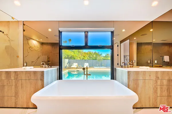 a room with a large window and a table