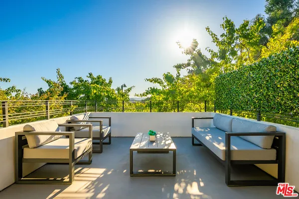 a view of a balcony with chairs
