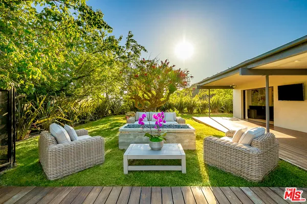 swimming pool with outdoor seating and patio