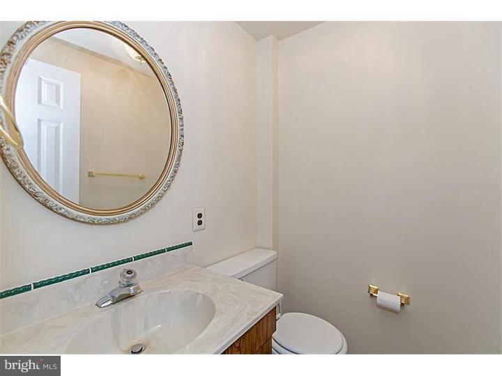 205 Chase Road Wayne, PA 19087 - Photo 15 of 23 a bathroom with a sink and a mirror