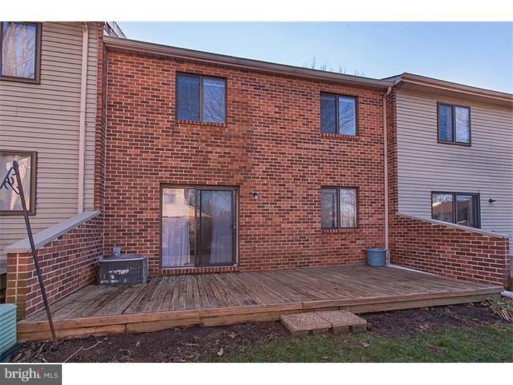 205 Chase Road Wayne, PA 19087 - Photo 23 of 23 a view of a brick house with many windows
