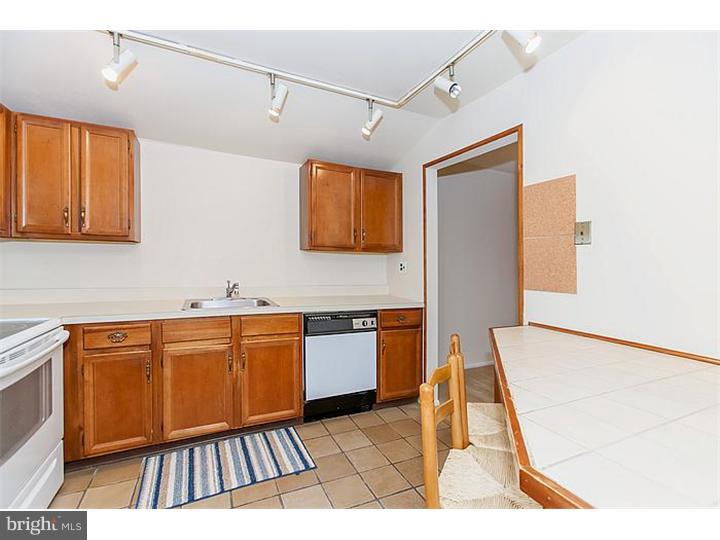 205 Chase Road Wayne, PA 19087 - Photo 8 of 23 a kitchen with granite countertop lots of counter top space and windows